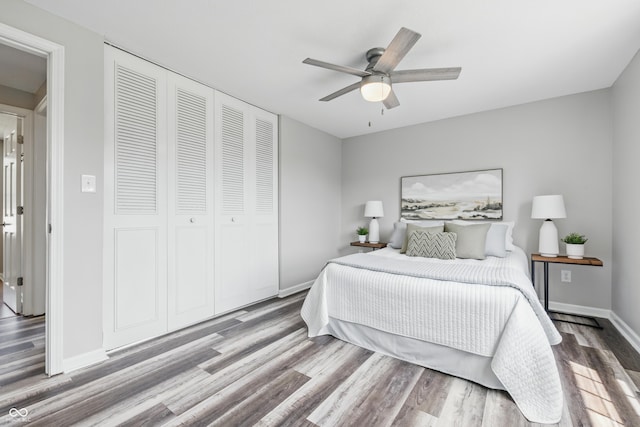 5503 Antoneli Ln, Indianapolis, IN 46237 - bedroom with a closet, wood finished floors, and a ceiling fan