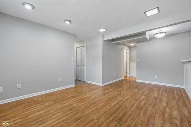 5503 Antoneli Ln, Indianapolis, IN 46237 - unfurnished room with light wood-type flooring and a textured ceiling