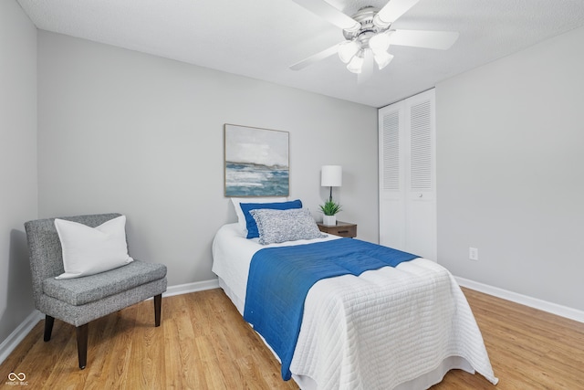 5503 Antoneli Ln, Indianapolis, IN 46237 - bedroom with a closet, light wood-type flooring, and ceiling fan