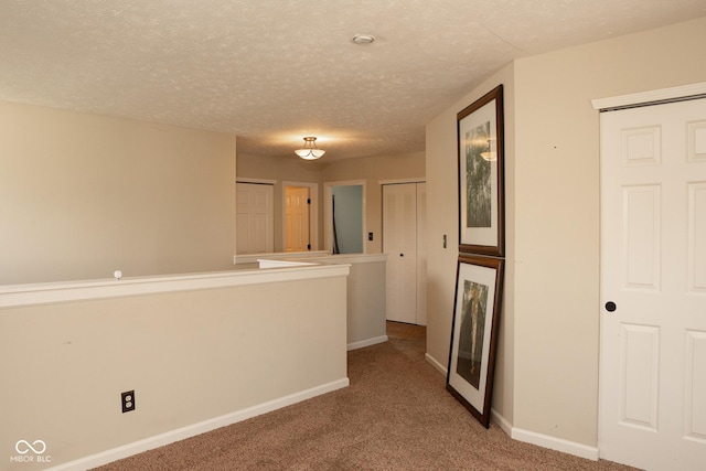 6585 Dunsdin Dr, Plainfield, IN 46168 - hallway with carpet and a textured ceiling