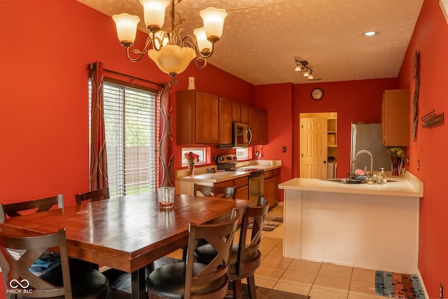 6585 Dunsdin Dr, Plainfield, IN 46168 - dining room featuring light tile patterned floors, a chandelier, and a textured ceiling