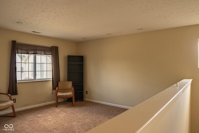 6585 Dunsdin Dr, Plainfield, IN 46168 - unfurnished room featuring carpet floors, a textured ceiling, and an upstairs landing