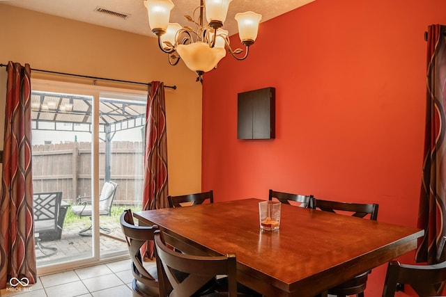 6585 Dunsdin Dr, Plainfield, IN 46168 - dining space with a chandelier and light tile patterned floors