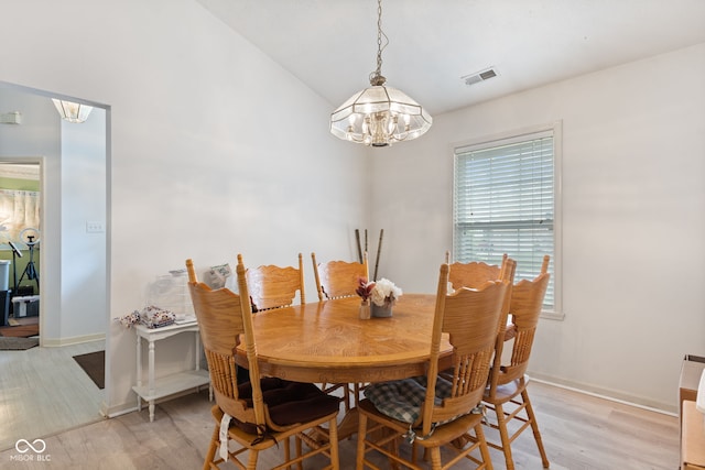 8038 Midlothian Way, Indianapolis, IN 46214 - dining area with a chandelier, light wood-style floors, and lofted ceiling