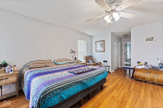 8038 Midlothian Way, Indianapolis, IN 46214 - bedroom featuring light wood-style floors, a ceiling fan, and a closet
