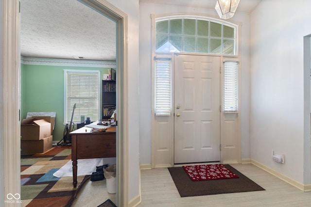 8038 Midlothian Way, Indianapolis, IN 46214 - entryway featuring light wood finished floors and a textured ceiling