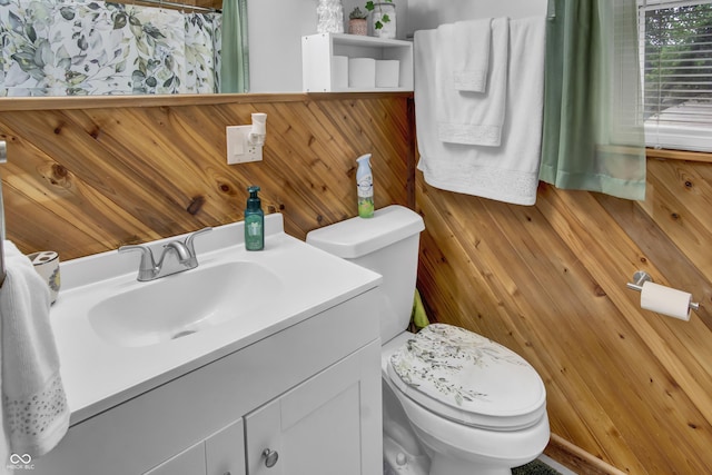 241 Wehmeier St, Columbus, IN 47201 - bathroom with vanity, wood walls, and curtained shower