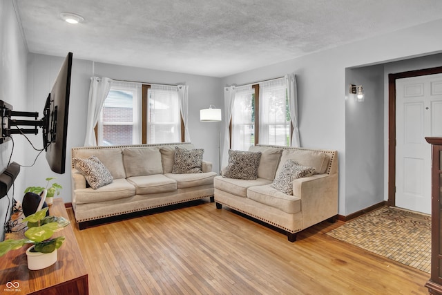 241 Wehmeier St, Columbus, IN 47201 - living area featuring wood-type flooring and a textured ceiling