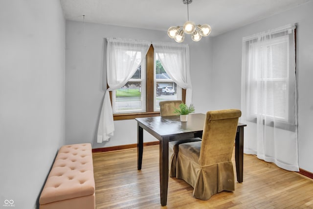 241 Wehmeier St, Columbus, IN 47201 - dining room with a chandelier, light wood-style flooring, and radiator heating unit