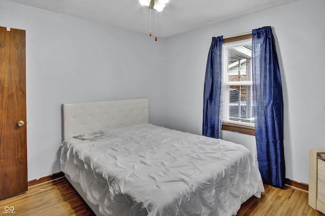 241 Wehmeier St, Columbus, IN 47201 - bedroom featuring hardwood / wood-style floors and baseboards