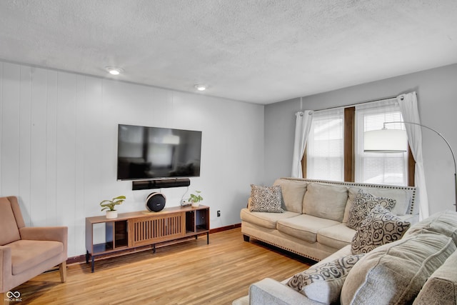 241 Wehmeier St, Columbus, IN 47201 - living room with wood finished floors and a textured ceiling