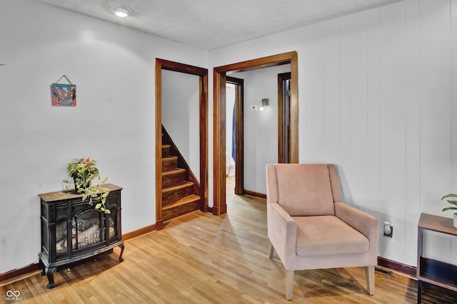 241 Wehmeier St, Columbus, IN 47201 - sitting room with light wood-style flooring and stairway