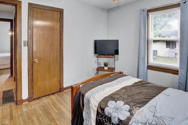 241 Wehmeier St, Columbus, IN 47201 - bedroom with light wood finished floors and multiple windows