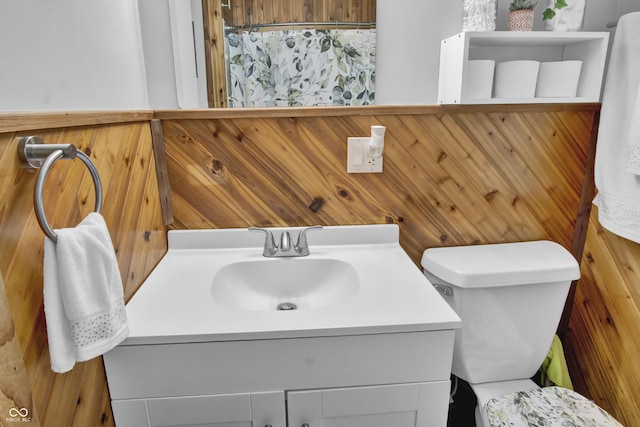 241 Wehmeier St, Columbus, IN 47201 - full bathroom featuring vanity, a shower with curtain, and wooden walls