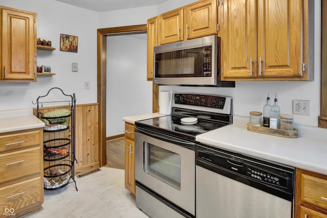 241 Wehmeier St, Columbus, IN 47201 - kitchen with stainless steel appliances, light countertops, a wainscoted wall, and open shelves