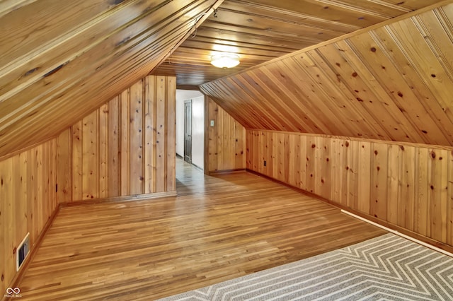 241 Wehmeier St, Columbus, IN 47201 - additional living space with wooden walls, wood finished floors, and vaulted ceiling