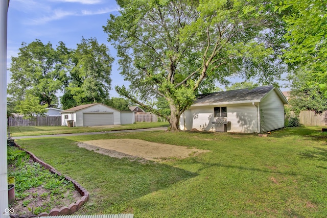 241 Wehmeier St, Columbus, IN 47201 - view of yard with a detached garage and an outdoor structure