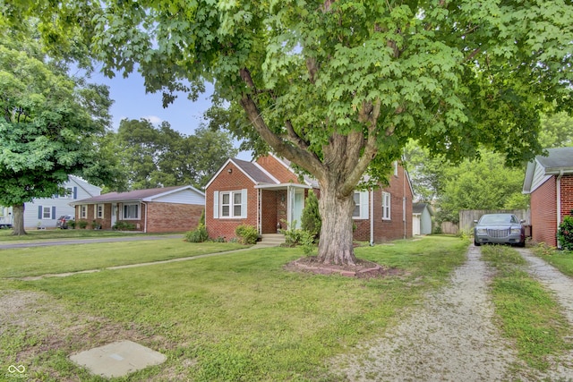 241 Wehmeier St, Columbus, IN 47201 - view of front facade featuring brick siding
