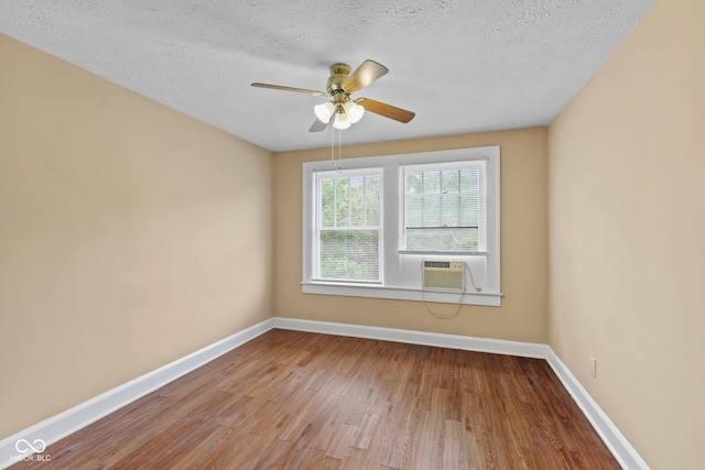 113 N Munsie St, Indianapolis, IN 46229 - spare room featuring wood finished floors, a textured ceiling, and a ceiling fan