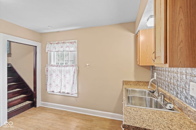 113 N Munsie St, Indianapolis, IN 46229 - kitchen with light countertops, light wood-type flooring, and light brown cabinetry