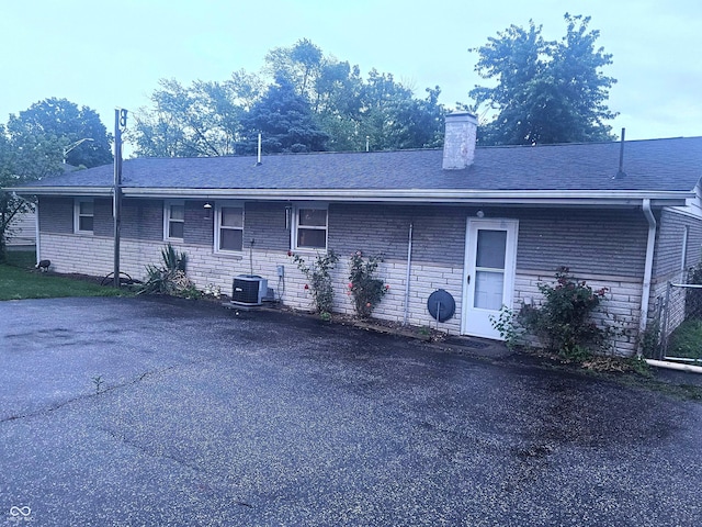 9470 N Old Port Royal, Martinsville, IN 46151 - back of house with a chimney, brick siding, and roof with shingles
