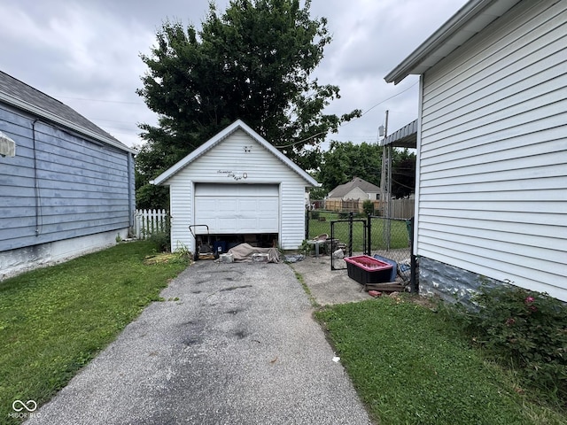 1768 N Lynhurst Dr, Speedway, IN 46224 - detached garage with asphalt driveway
