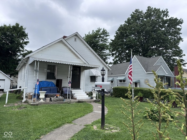 1768 N Lynhurst Dr, Speedway, IN 46224 - bungalow-style house with entry steps and a front yard