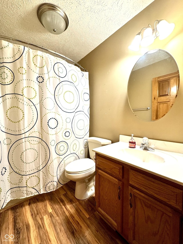 526 Jefferson Vly, Coatesville, IN 46121 - full bath featuring vanity, a textured ceiling, wood finished floors, and a shower with shower curtain