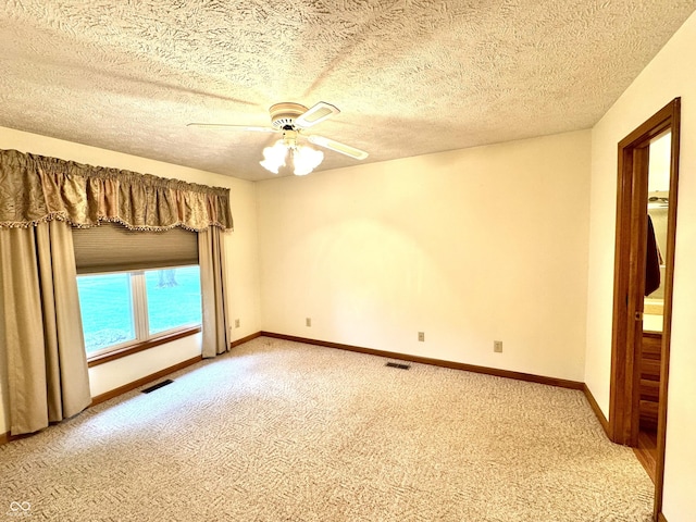 526 Jefferson Vly, Coatesville, IN 46121 - unfurnished room with light colored carpet, ceiling fan, and a textured ceiling
