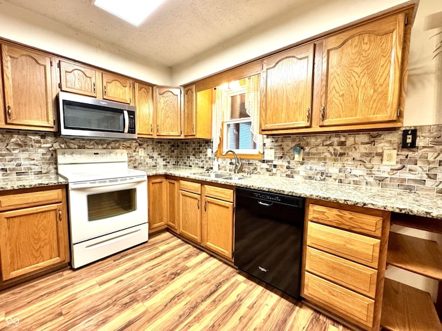 526 Jefferson Vly, Coatesville, IN 46121 - kitchen featuring stainless steel microwave, black dishwasher, white electric range, light wood-style flooring, and tasteful backsplash