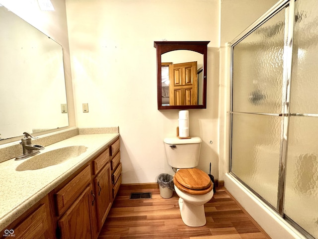 526 Jefferson Vly, Coatesville, IN 46121 - bathroom featuring wood finished floors, vanity, and a stall shower