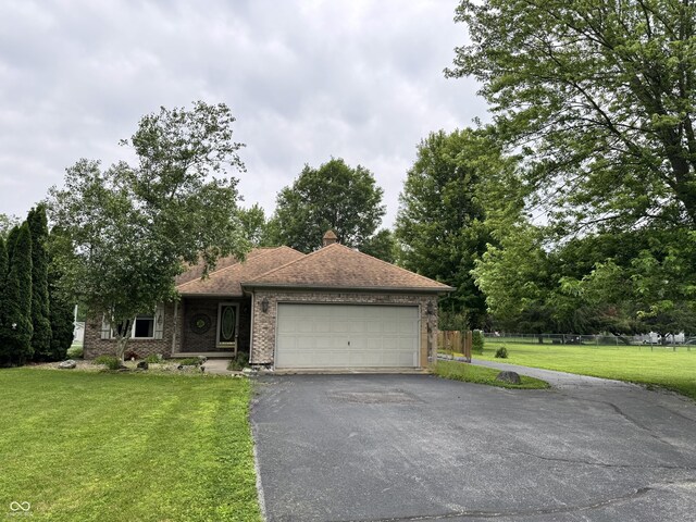 526 Jefferson Vly, Coatesville, IN 46121 - ranch-style house featuring asphalt driveway, an attached garage, brick siding, and a shingled roof