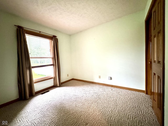 526 Jefferson Vly, Coatesville, IN 46121 - spare room featuring carpet flooring and a textured ceiling