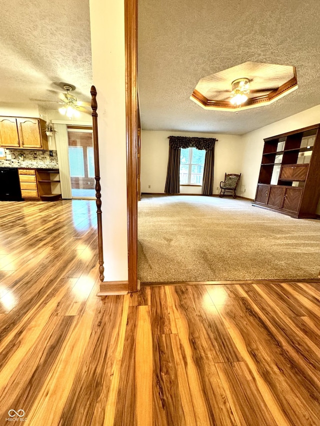 526 Jefferson Vly, Coatesville, IN 46121 - unfurnished living room featuring a textured ceiling, a ceiling fan, and wood finished floors