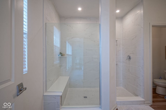 9728 Junction, Fishers, IN 46037 - full bathroom featuring a shower stall, recessed lighting, and wood finished floors