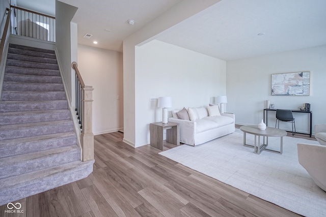 9728 Junction, Fishers, IN 46037 - living area with wood finished floors, stairway, and recessed lighting
