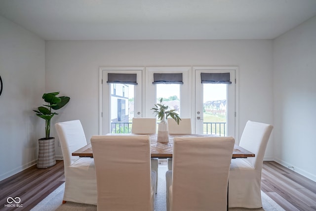 9728 Junction, Fishers, IN 46037 - dining space with healthy amount of natural light, light wood finished floors, and french doors