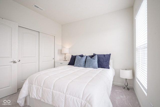 9728 Junction, Fishers, IN 46037 - bedroom featuring light colored carpet, multiple windows, and a closet