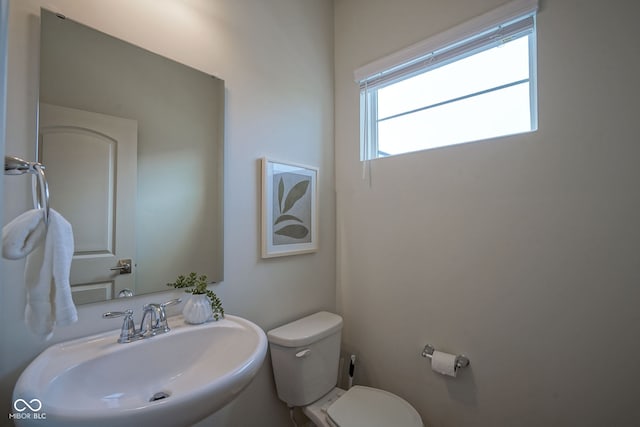 9728 Junction, Fishers, IN 46037 - half bathroom featuring a sink and toilet