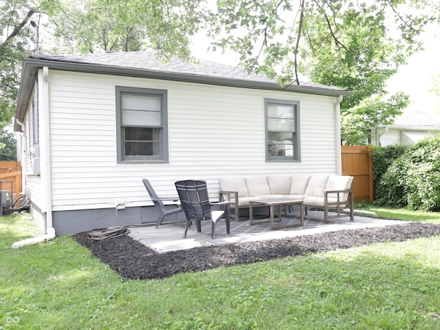 4445 Kingsley Dr, Indianapolis, IN 46205 - back of property featuring an outdoor living space, a patio area, and roof with shingles