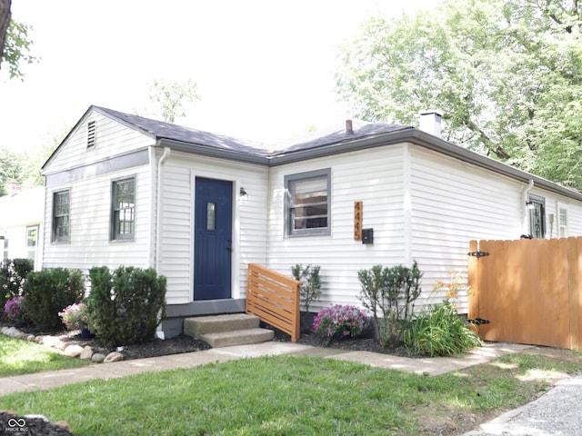 4445 Kingsley Dr, Indianapolis, IN 46205 - view of front of property featuring entry steps and a chimney