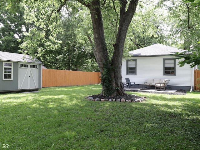 4445 Kingsley Dr, Indianapolis, IN 46205 - view of yard with a patio, a storage shed, and an outdoor living space