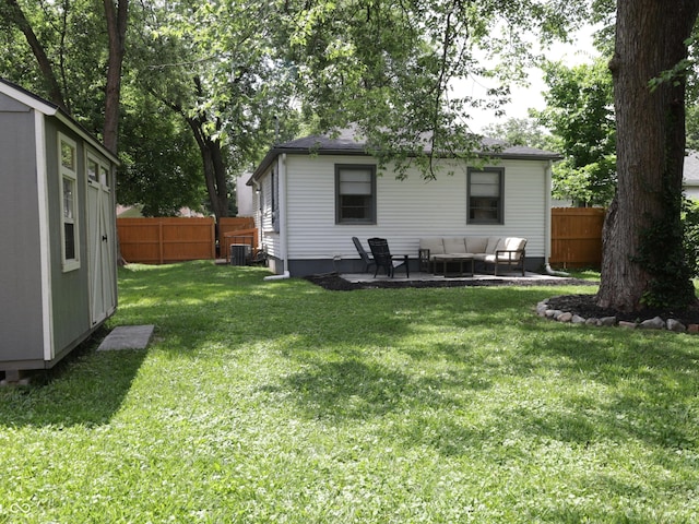 4445 Kingsley Dr, Indianapolis, IN 46205 - back of property with an outdoor living space and a patio