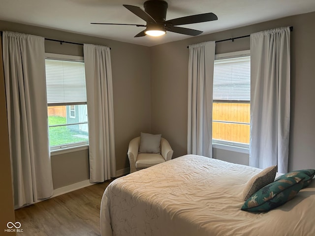 4445 Kingsley Dr, Indianapolis, IN 46205 - bedroom with wood finished floors and a ceiling fan