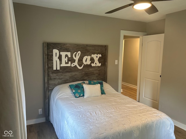 4445 Kingsley Dr, Indianapolis, IN 46205 - bedroom featuring wood finished floors and a ceiling fan
