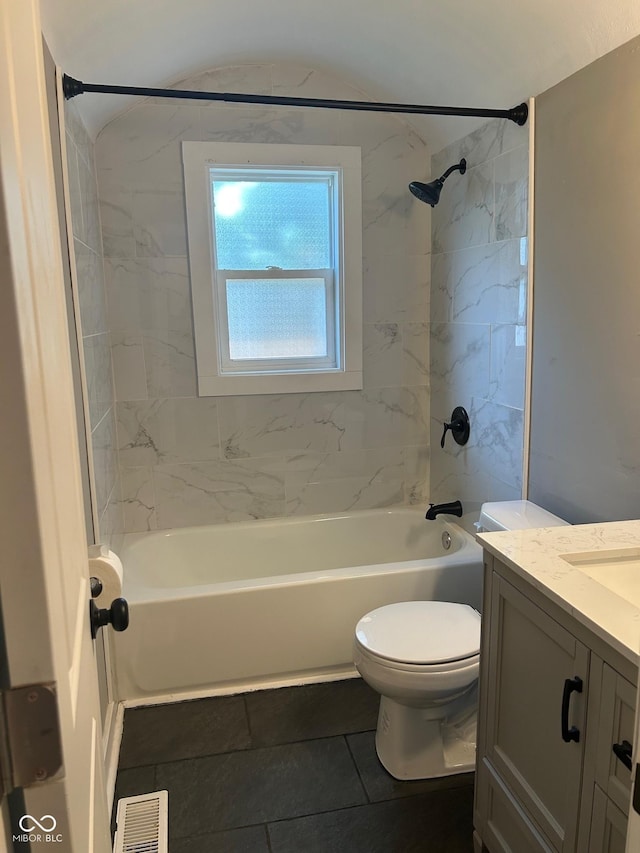 4445 Kingsley Dr, Indianapolis, IN 46205 - full bath with vanity,  shower combination, tile patterned flooring, and vaulted ceiling