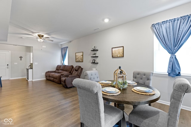 2733 Lamar Dr, Whitestown, IN 46075 - dining room featuring wood finished floors, a ceiling fan, healthy amount of natural light, and recessed lighting
