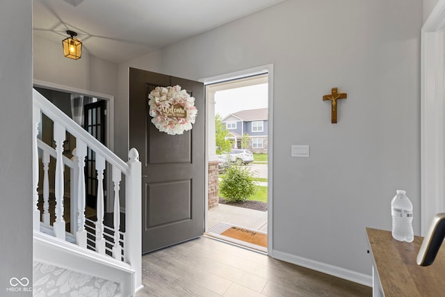 2733 Lamar Dr, Whitestown, IN 46075 - entrance foyer featuring wood finished floors and stairway