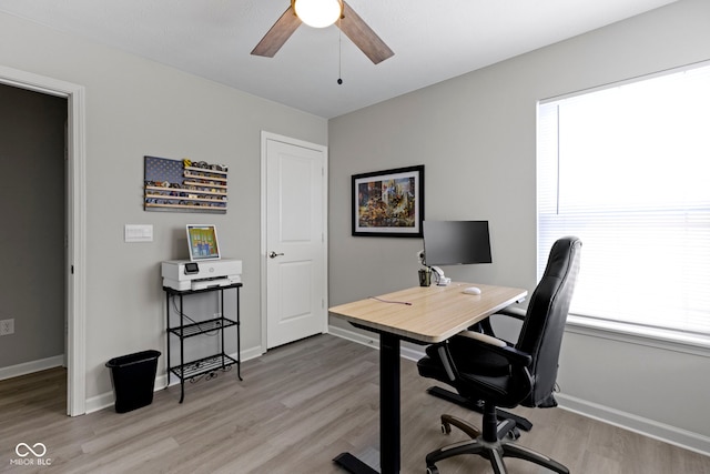 2733 Lamar Dr, Whitestown, IN 46075 - home office with light wood finished floors and ceiling fan