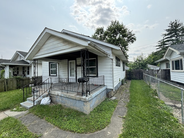 1226 Hiatt St, Indianapolis, IN 46221 - shotgun-style home with a porch
